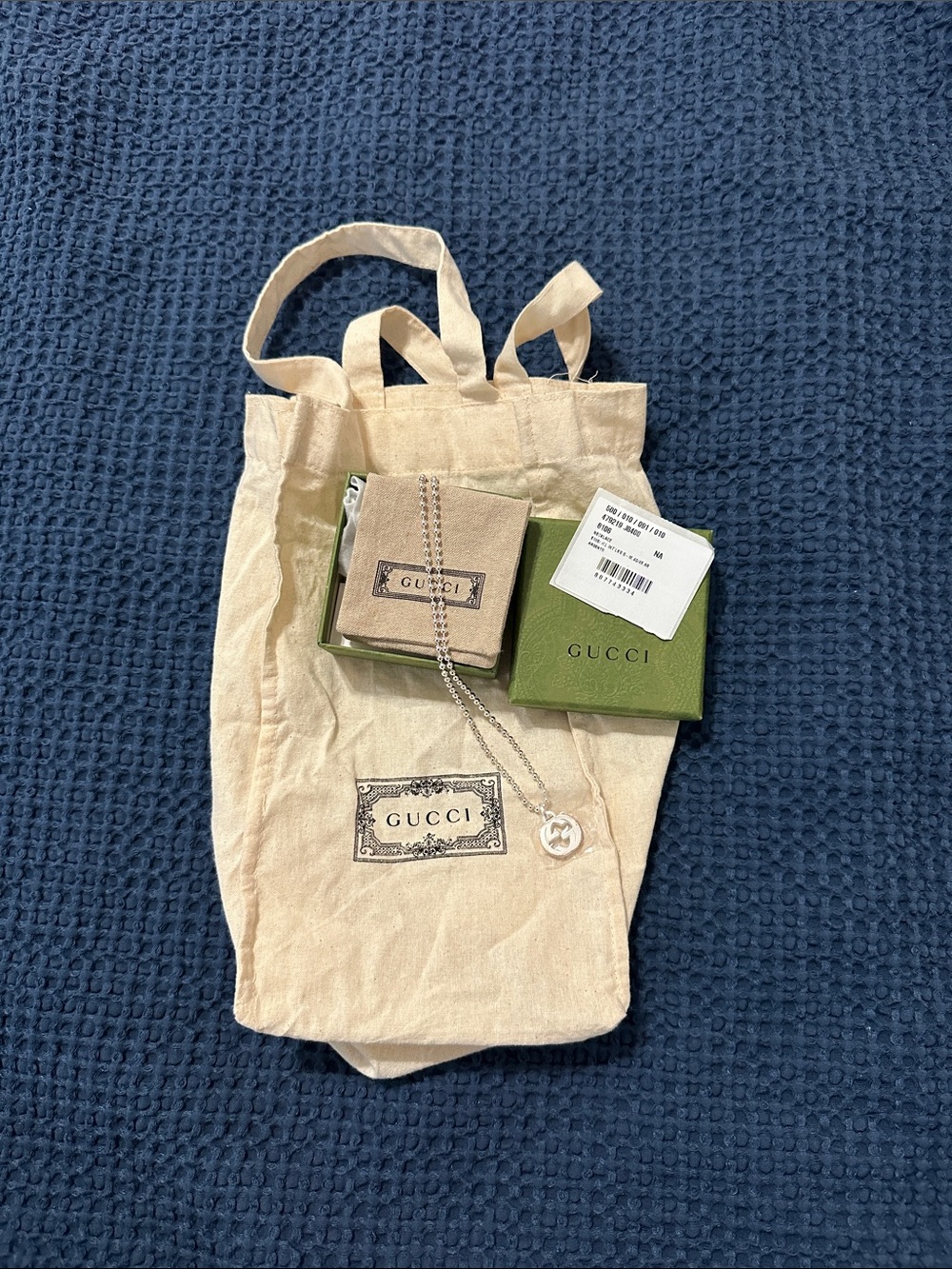 Gucci Cream Canvas Tote with Silver Pendant